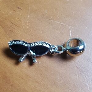 NWOT charm, black and silver colored sunglasses